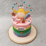 The star chick of this chick birthday cake for kids is at the top with a pink bow on its head, wings spread in a warm, welcoming way, eyes closed with a happy little smile on its face.