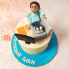 The character on this Living Room Cake, with his expressive face and laid-back pose, holds a remote control, perfectly capturing the essence of a well-deserved, lazy day spent in front of the TV. 