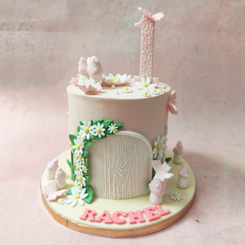 Picture a light pastel pink base, akin to the rosy hues of a sunrise, adorned with delicate white flowers cascading like waterfalls and verdant green leaves dancing in the gentle breeze and that would paint you the visual of this Fairy Land Theme Cake. 