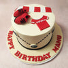 Paired with a matching scarf and iconic red and black shoes, this Football Theme Cake is a tribute to the devoted spirit of fans who live and breathe football.