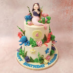 The tiers of this aquatic theme cake are embellished with an array of colourful aquatic flora and fauna. 