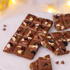 Milk Diwali chocolate bar topped with almonds, cashew and raisins.