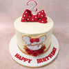 Adding an extra touch of sophistication to the design of this Minnie Mouse minimalist cake, delicate gold leaves and vibrant red roses are arranged beneath Minnie's silhouette, resembling a corsage. 