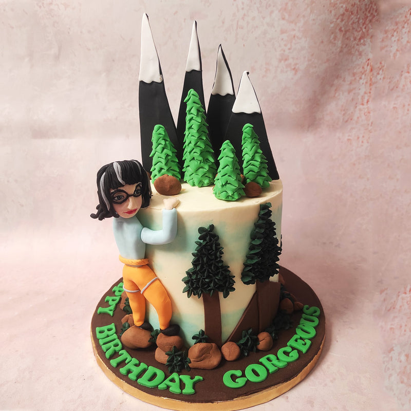 As your gaze ascends this mountain climbing cake, you encounter a picturesque landscape of snow-capped peaks. 