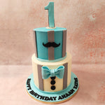 Below the edible light-blue bow tie on the bottom tier of this moustache cake you'll spot black buttons.