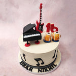 Atop this bongos cake design, you will find meticulously crafted 3D models of three iconic musical instruments: a grand piano, bongos, and an electric guitar. 