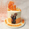 The striking orange and cream colour scheme of this Naruto Shippuden Cake immediately catches the eye, creating a lively and engaging atmosphere perfect for any celebration. 