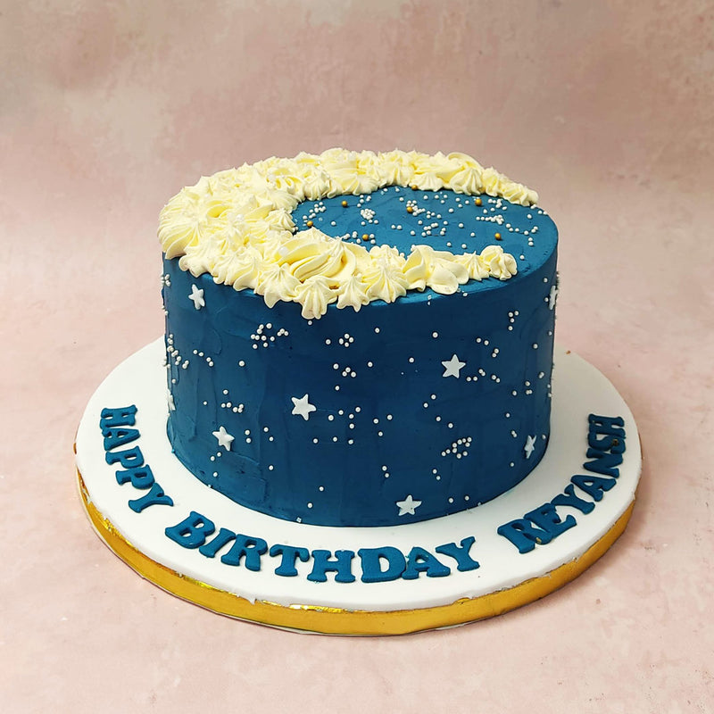 Crafted from delicate rosette buttercream swirls the moon of this starry night cake symbolises the beauty and mystery of the night sky. 