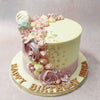 The buttercream roses on this pearl cake are accented with lustrous, white pearls and edible gold flakes.