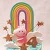 As your eyes travel upwards, you'll be greeted by Peppa herself, standing proudly in front of a magnificent rainbow on top of this Peppa and fam cake. 