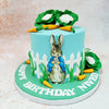 Standing proudly in his signature blue jacket, Peter Rabbit takes centre stage on this Peter Rabbit Cabbage Cake, ready to hop into a world of imagination. 