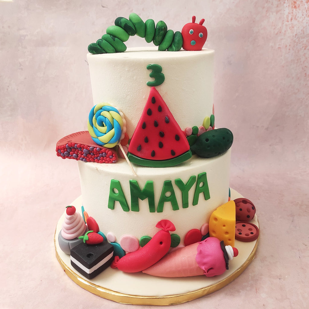 At the base of this Snacks Cake, a playful array of colourful polka dots sets the stage, inviting you to a whimsical journey filled with sweet surprises.
