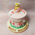 At the pinnacle of this Pink Bear Cake, an adorable yellow teddy bear steals the spotlight, wearing a pink bow in its ear and cradling a matching pink blanket. 