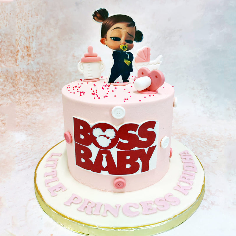 This Pink Boss Baby Cake is  adorned with charming baby-themed decorations like a milk bottle and pram,  inspired by the ever-bossy and charismatic character from the hit film Boss Baby. 