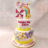 At the base of this Windmill Cake, a soft pink canvas adorned with a fault line of sunny yellow, reminiscent of rolling hills dotted with vibrant yellow flowers, greeted the eye with warmth and cheer.
