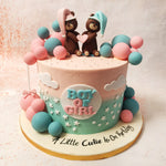 The top of this Pink and Blue Teddy Bear Cake features two cute teddy bears holding a heart, representing the love and excitement shared by the parents-to-be. 