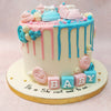 Playing with the traditions of pink for girl and blue for boy in the colour palette, this pink and blue baby shower cake carries forward all the sentiments of a gender reveal with the underlying message of "he or she, what will it be?"