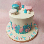 Edible gold leaves accentuate the tiers of this Pink And Blue Cake, glistening like the promise of a new chapter.