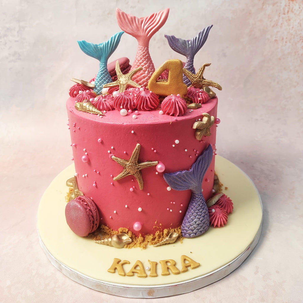 On a vibrant pink base resembling the hues of a magical sunset, our Pink Mermaid Tail Cake invites you into a world of enchantment and wonder. 