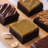 Fudgy dark chocolate brownie with thick green pistachio ganache topping
