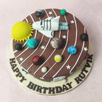 Rockets and spaceships orbit the circumference, adding an extra dimension of excitement to the cosmic confection of this Solar System Cake. 