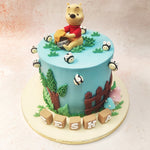 This whimsical creation features the beloved bear himself, lovingly crafted and perched atop this Pooh Bear Cake, cradling a pot of Hunny. 