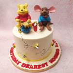 What truly sets this Winnie The Pooh cake apart is the inclusion of bumble bees following the honey trail.