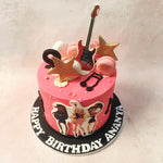 With whimsical buttercream music notes, this Girl Group Cake features a charming guitar, surrounded by pink and white macarons, and sprinkled with edible gold stars.