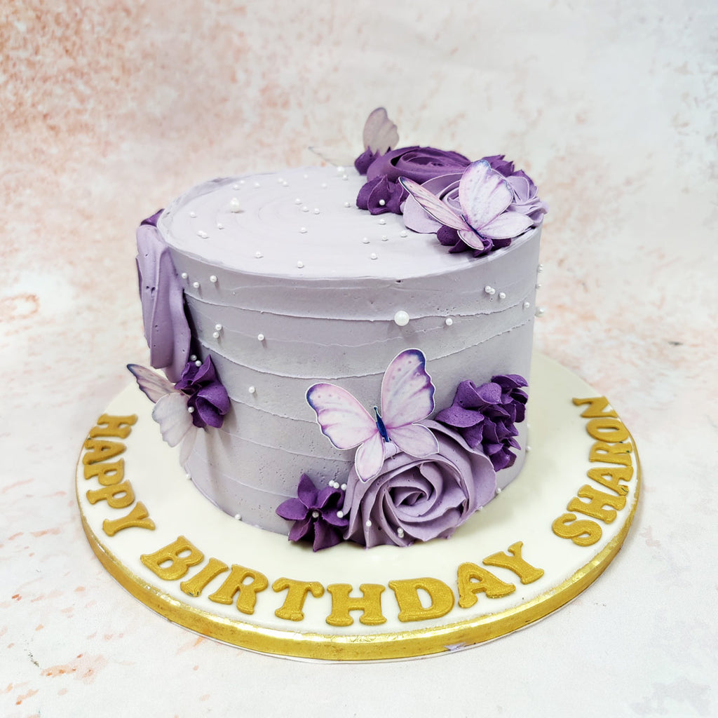 This elegant Purple Cake With Butterflies captures the ephemeral beauty of butterflies in flight, transforming a simple celebration into something truly magical. 