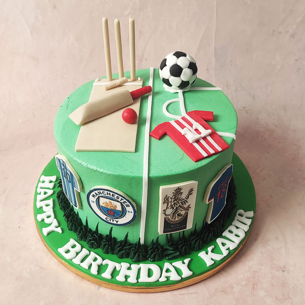 Dark green buttercream pipings form a lush ground on this Cricket and Football Cake, as if inviting players to tread upon this vibrant sports-themed confection.