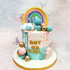 The pristine backdrop of this Rainbow Drip Baby Shower Cake is artfully adorned with contrasting drips of soft blue and delicate pink, symbolising the age-old question that brings loved ones together in joyful speculation.