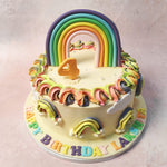This Rainbow Swirl Cake is adorned with whimsical buttercream swirls forming a kaleidoscope of colour.