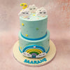 The bottom tier of this celestial cake features an eye-catching, three-dimensional rainbow with smiley-faced clouds on either end.
