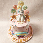 The unicorn watched over a vibrant rainbow that arched gracefully through this star theme cake’s centre complemented by gold stars and fluffy white clouds. 