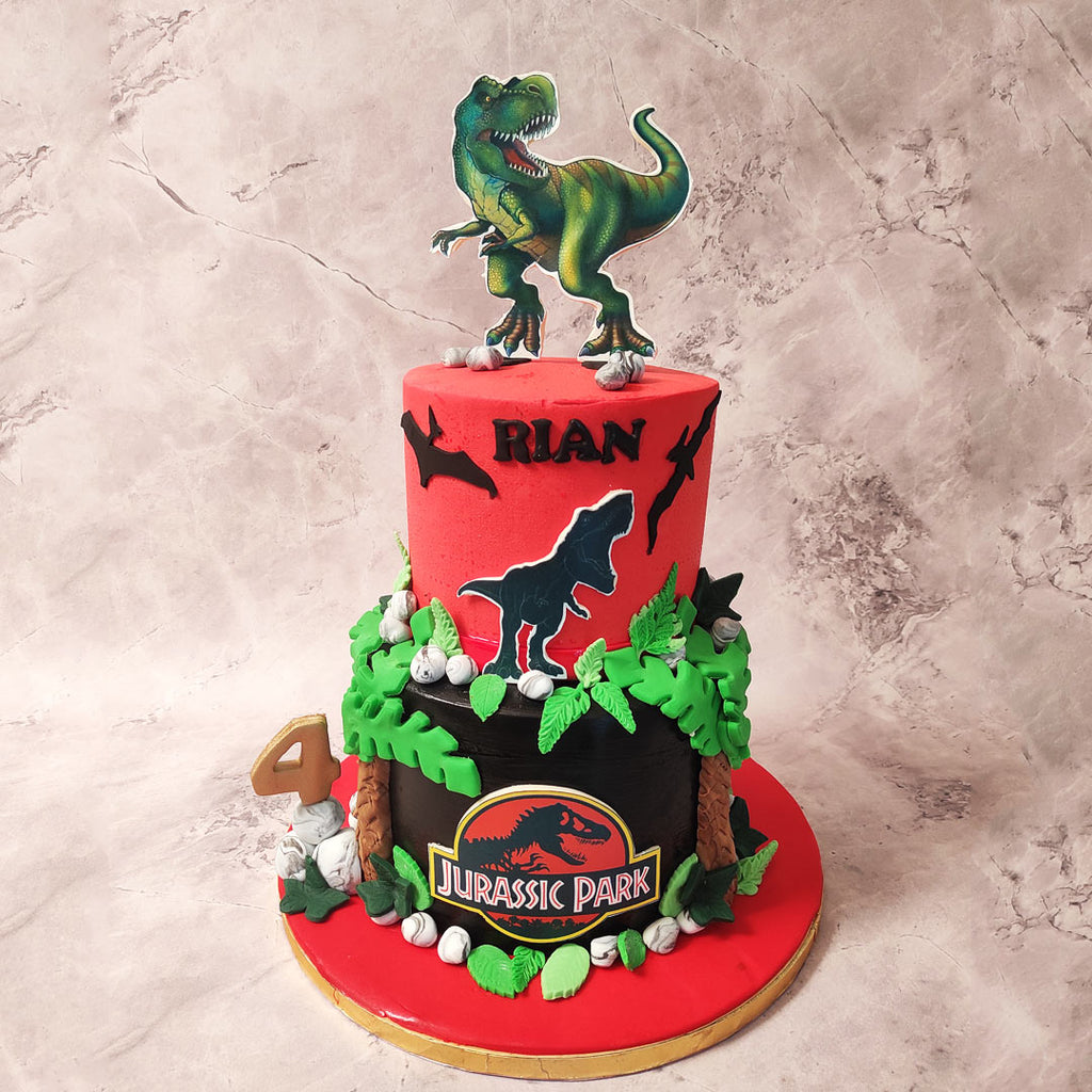 Adorning this tier of our Jurassic Theme Cake is the iconic Jurassic Park logo, instantly recognizable to any fan. 