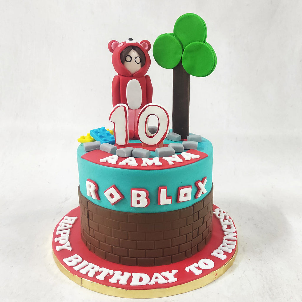 With a base adorned in chocolate bricks, symbolising the foundation of every virtual world, and a captivating sky blue top, this simple Roblox cakeis a visual feast that will transport you straight into the vibrant realm of Roblox.