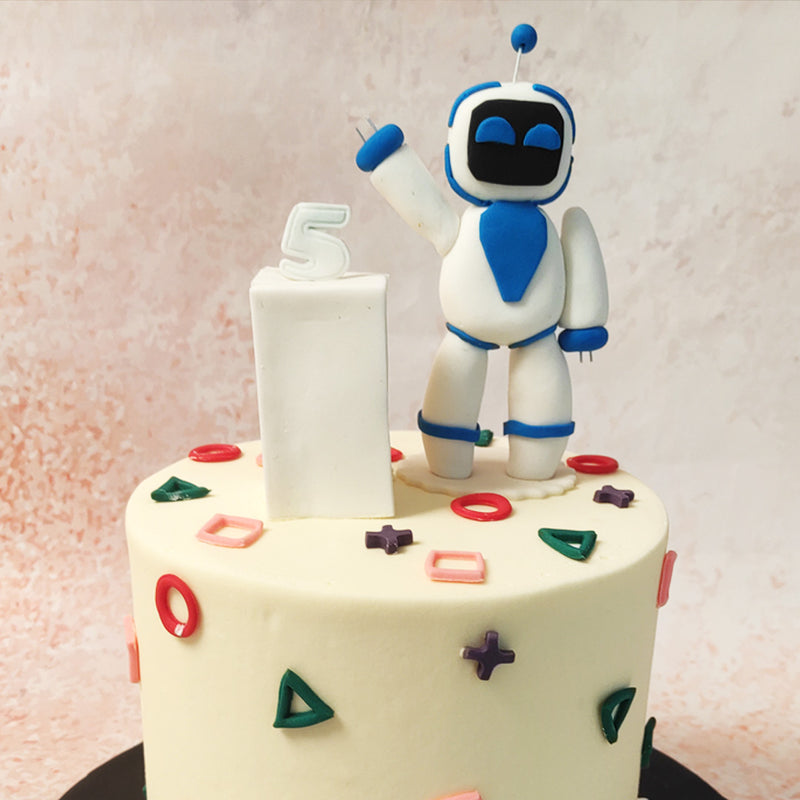 The sleek, white robot on top of this Robo Cake with its friendly wave is a playful nod to the animated characters that bring joy and adventure to young minds. 