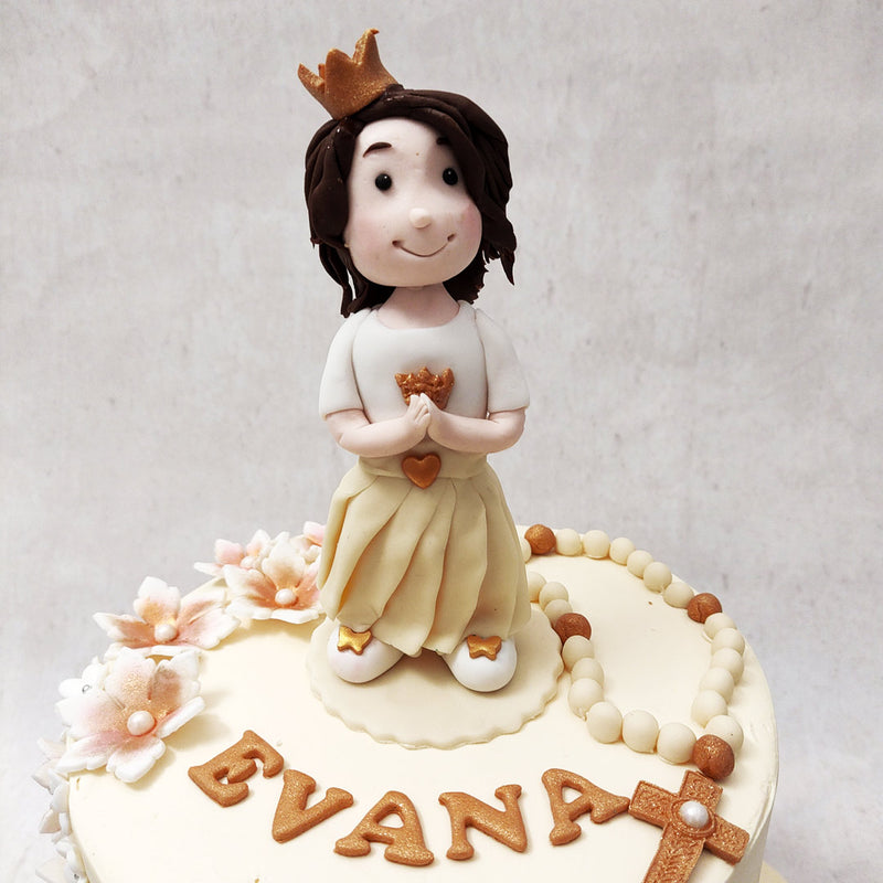 This Eucharist cake design features the rosary, the cross, white flowers and a crowned girl dressed in all white (the traditional attire of receiving one's First Holy Communion). 