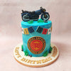 Perched atop this Bike Theme Cake, a navy blue Royal Enfield figurine stands as a beacon of adventure, ready to conquer new horizons.