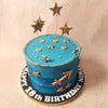 Gold stars shoot across this Horoscope Cake like fragments of stardust, illuminating the celestial pathway. 