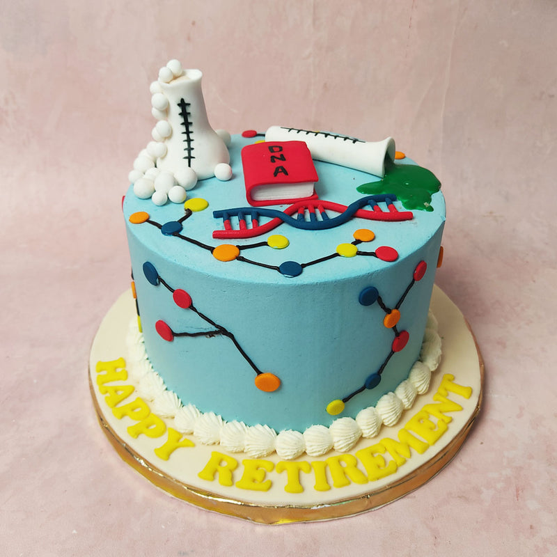 The vibrant blue base of this Science Theme Cake serves as the canvas for an intricate display of molecular geometry, resembling colourful structures that beckon to the curious minds. 