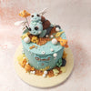 This charming Sea Life Cake features a delightful scene of sea creatures, including an adorable turtle with its baby perched atop, surrounded by vibrant coral reefs and playful fish. 