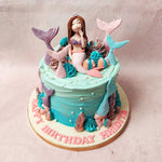 The creamy pink and blue buttercream pipings echo the hues of mermaid tails embellish this Sea Waves Cake