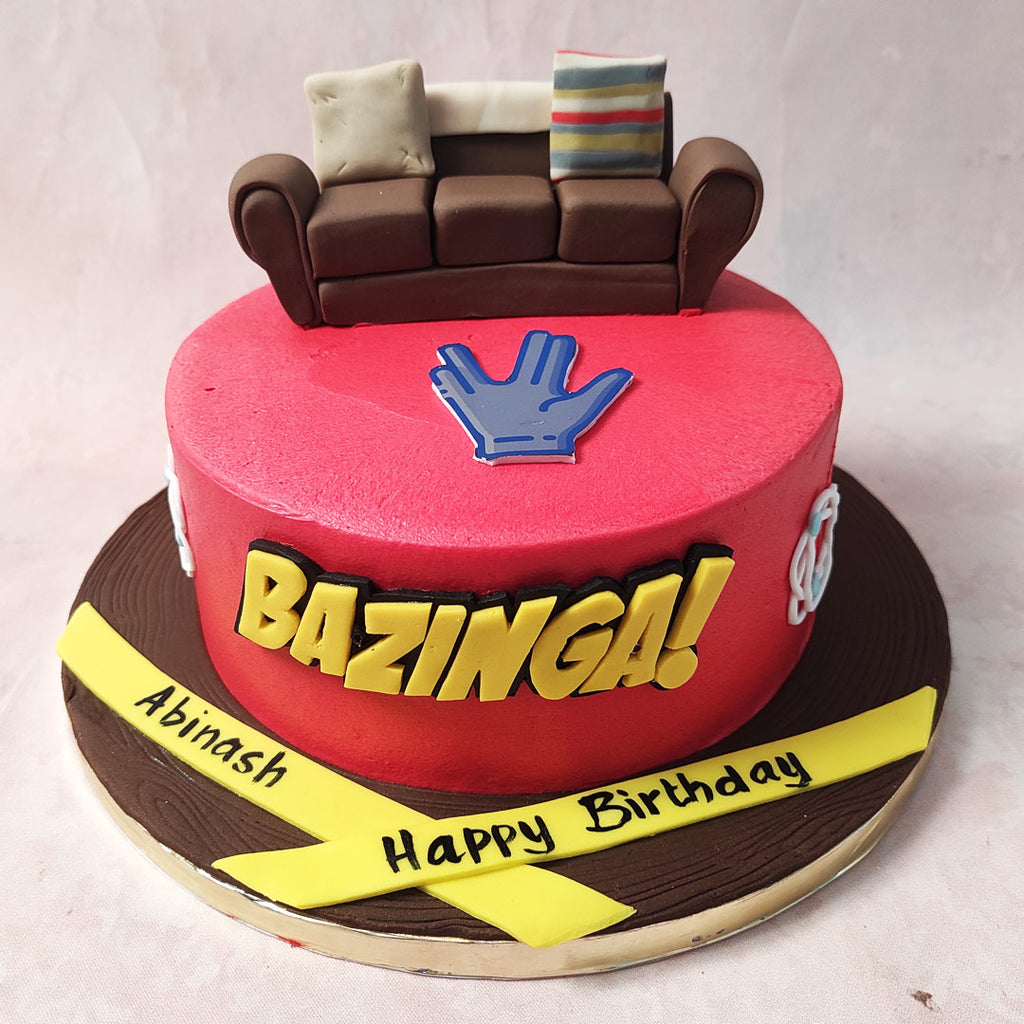 Sheldon Cooper's famous exclamation after pulling a prank has now been turned into this one of a kind Bazinga cake, recreating the famous BBT couch set on top of a red base which matches Sheldon's iconic shirts. 