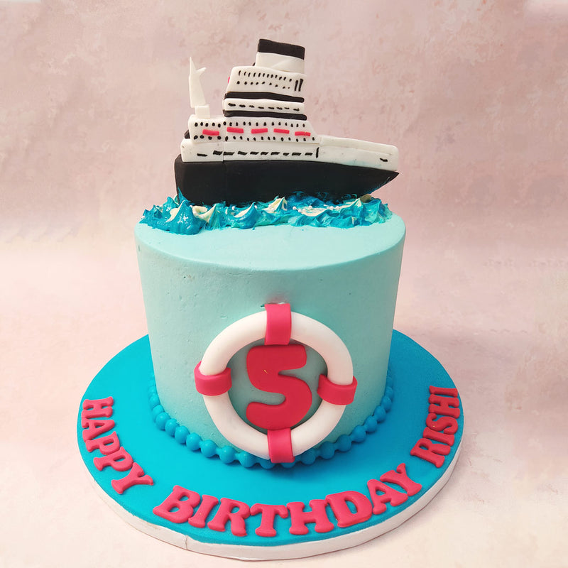 This Ship Cake design features a light blue base adorned with meticulously crafted waves of white and blue buttercream on top, evoking the serene beauty of the open sea. 