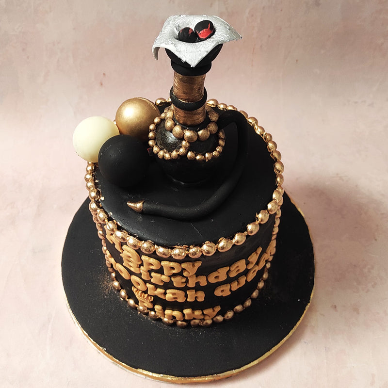 Adorning the edges of this smoking cake are meticulously handcrafted golden pearls, each shimmering under light, adding a regal touch to this confectionery wonder. 