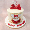 Her unmistakable red and white polka dot bow sits proudly on top of her head, adding a touch of whimsy to the design of this Minnie Mouse silhouette cake!
