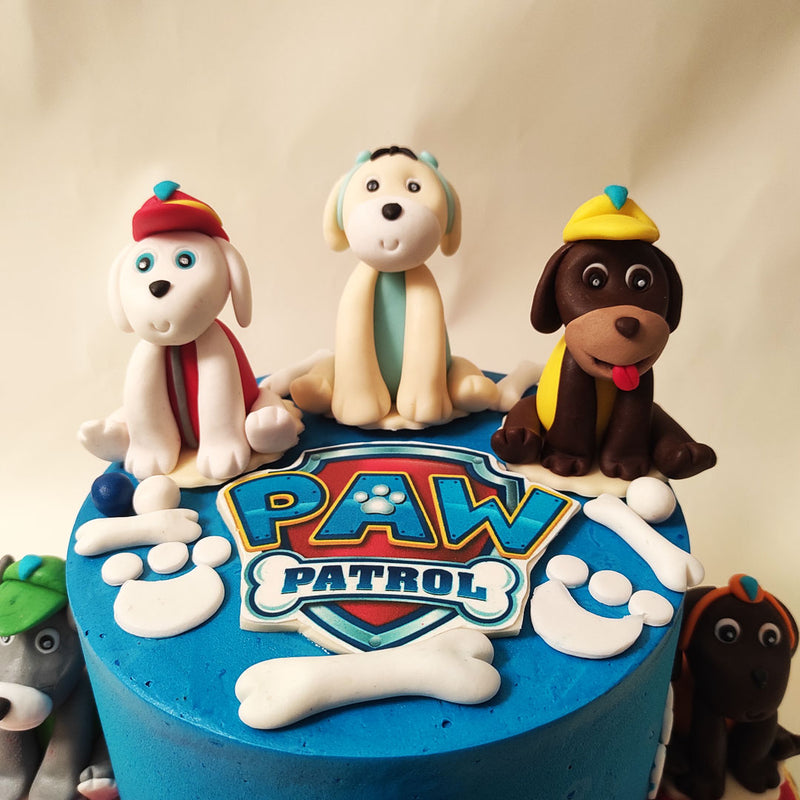 Embellished with white paw prints, this blue Paw Patrol cake symbolises the paw-some teamwork and unity that these heroic pups demonstrate.