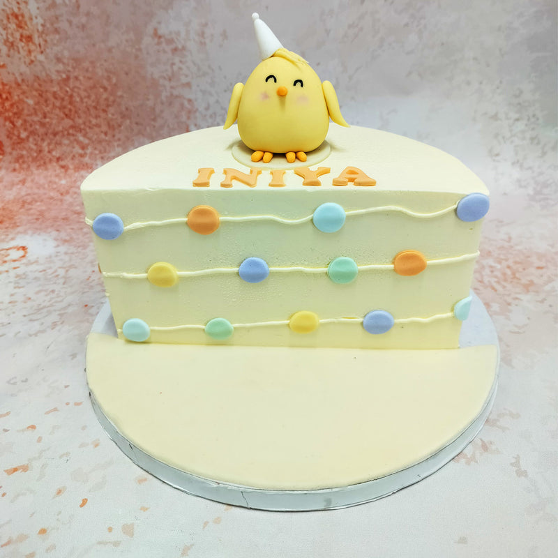 Featuring a cute yellow bird with a party hat perched on top, this Chicklet Cake is a perfect blend of whimsy and celebration. 