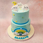 These smiley-faced clouds are thematically scattered throughout this two tier cloud cake, complemented by the silver pearls, vibrant colours of the rainbow and the matching colours hearts garnishing the entire design.